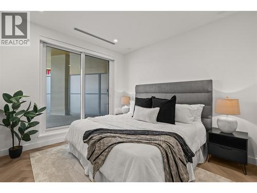Primary Bedroom with Terrace access - 3340 Lakeshore Road Unit# 902, Kelowna, BC - Indoor Photo Showing Bedroom