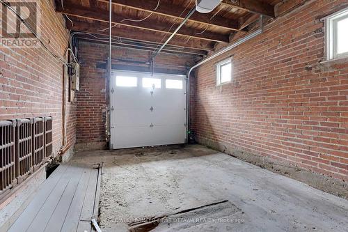 One car garage with kitchen & basement access - 2 Gladstone Avenue, Smiths Falls, ON - Indoor Photo Showing Garage