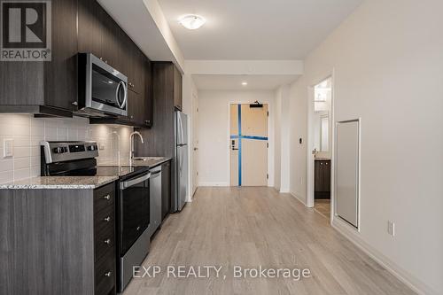 Ph1210 - 3006 William Cutmore Boulevard, Oakville, ON - Indoor Photo Showing Kitchen With Stainless Steel Kitchen