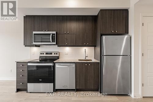 Ph1210 - 3006 William Cutmore Boulevard, Oakville, ON - Indoor Photo Showing Kitchen With Stainless Steel Kitchen