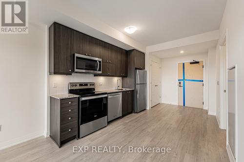 Ph1210 - 3006 William Cutmore Boulevard, Oakville, ON - Indoor Photo Showing Kitchen With Stainless Steel Kitchen