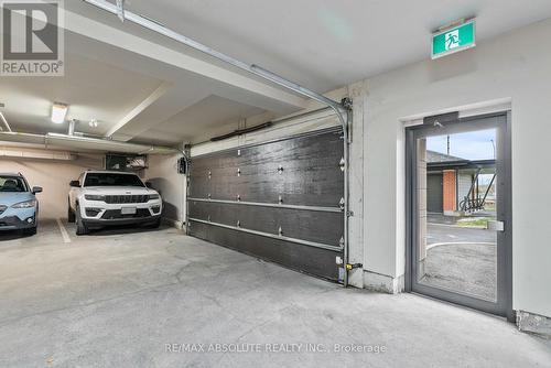 205 - 180 Boundstone Way, Ottawa, ON - Indoor Photo Showing Garage