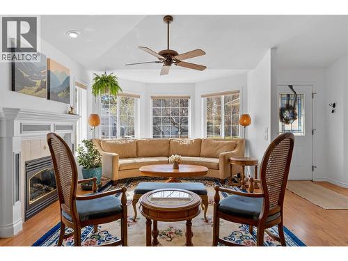 Living room with large windows with ample natural light - 1474 Rose Meadow Drive, West Kelowna, BC - Indoor Photo Showing Living Room With Fireplace