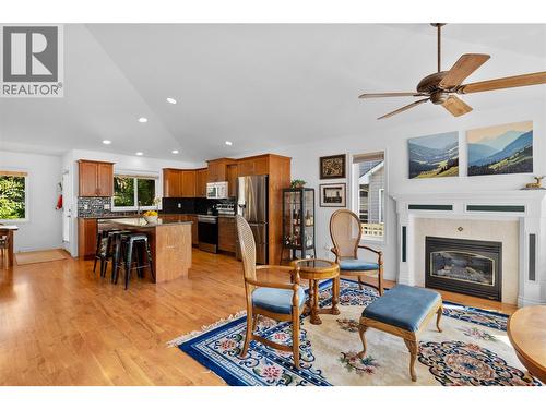 Open concept living and dining space. - 1474 Rose Meadow Drive, West Kelowna, BC - Indoor Photo Showing Living Room With Fireplace