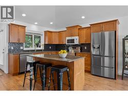 Granite counters and island with seating. - 