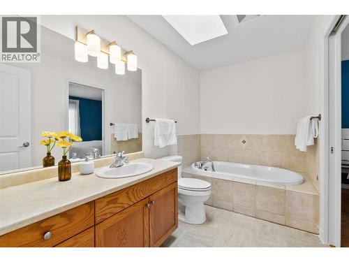 Main floor bathroom, with primary bedroom access. - 1474 Rose Meadow Drive, West Kelowna, BC - Indoor Photo Showing Bathroom