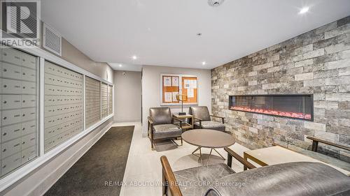 304 - 610 Farmstead Drive, Milton, ON - Indoor With Fireplace