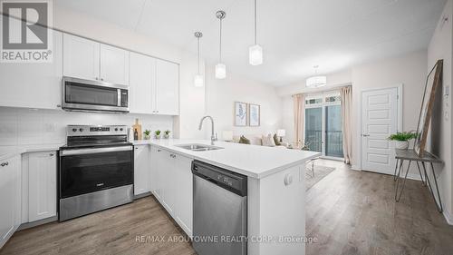 304 - 610 Farmstead Drive, Milton, ON - Indoor Photo Showing Kitchen With Stainless Steel Kitchen With Double Sink With Upgraded Kitchen