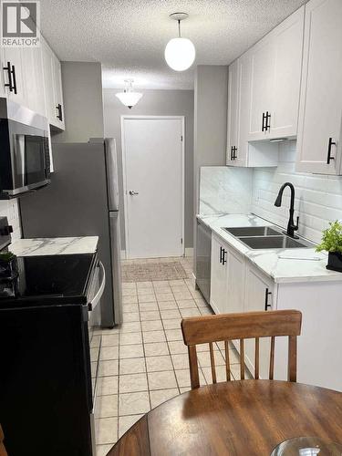110 Skaha Place Unit# 304, Penticton, BC - Indoor Photo Showing Kitchen With Double Sink