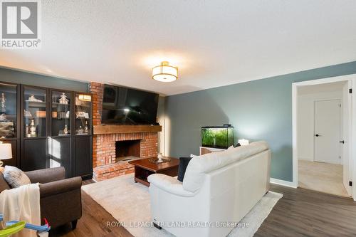 42 Benedict Court, London East (East C), ON - Indoor Photo Showing Living Room With Fireplace