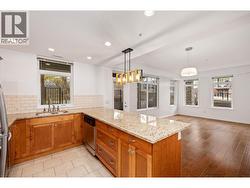 Maple finished cupboards and granite countertops - 