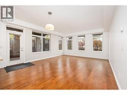 Plenty of light fills the living room with 2 walls of windows - 