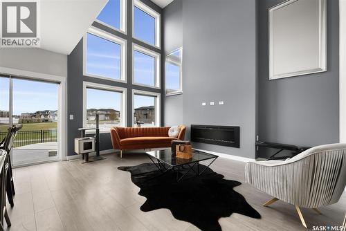 3640 Gee Crescent, Regina, SK - Indoor Photo Showing Other Room With Fireplace