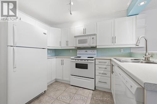 White is still a timeless & popular kitchen colour - 54 - 227 Ridgepark Private, Ottawa, ON - Indoor Photo Showing Kitchen With Double Sink