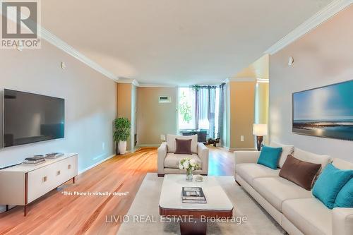 706 - 2470 Eglinton Avenue W, Toronto, ON - Indoor Photo Showing Living Room