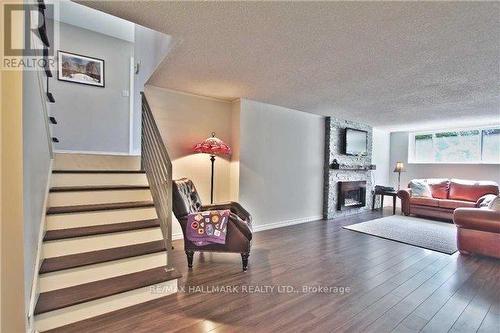 208 Pine Cove Road, Burlington, ON - Indoor Photo Showing Living Room With Fireplace