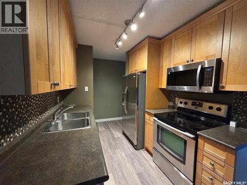 207B 4040 8Th Street E, Saskatoon, SK - Indoor Photo Showing Kitchen With Double Sink