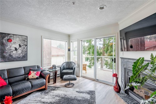 306-1 Buddy Rd, View Royal, BC - Indoor Photo Showing Living Room With Fireplace