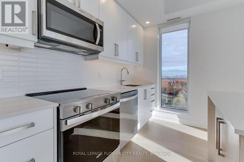 1808 - 3240 William Coltson Avenue E, Oakville, ON - Indoor Photo Showing Kitchen With Upgraded Kitchen