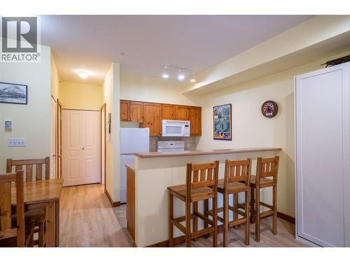 Kitchen and kitchen island counter - 9812 Silver Star Road Unit# 103, Vernon, BC - Indoor Photo Showing Kitchen