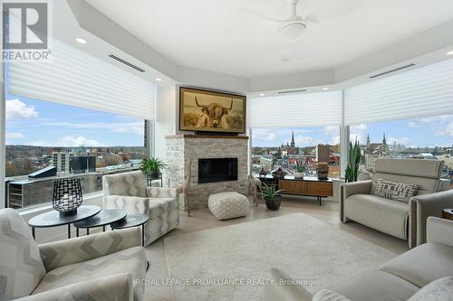 1004 - 15 St Andrew Street, Brockville, ON - Indoor Photo Showing Living Room With Fireplace