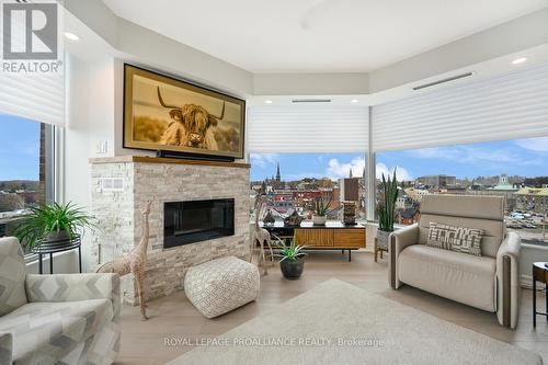 1004 - 15 St Andrew Street, Brockville, ON - Indoor Photo Showing Living Room With Fireplace