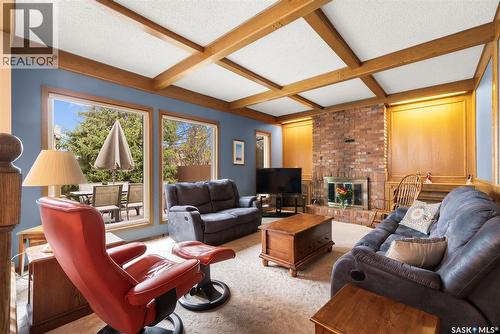 122 Groome Avenue, Regina, SK - Indoor Photo Showing Living Room With Fireplace