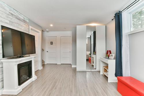 Salle familiale - 259Z  - 261Z Rue Des Érables, Lavaltrie, QC - Indoor With Fireplace