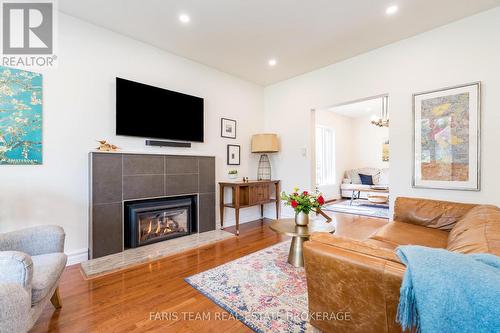 7 Bailey Crescent, Tiny, ON - Indoor Photo Showing Living Room With Fireplace