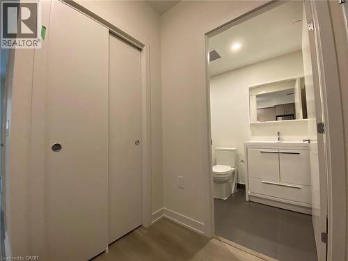 Half bath featuring vanity, dark wood finished floors, and recessed lighting - 212 King William Street Unit# 1010, Hamilton, ON - Indoor Photo Showing Bathroom