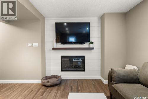 5122 Snowbirds Crescent, Regina, SK - Indoor Photo Showing Living Room With Fireplace
