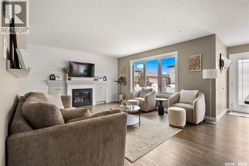 5122 Snowbirds Crescent, Regina, SK - Indoor Photo Showing Living Room With Fireplace