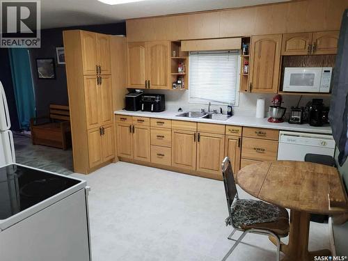 719 Donald Street, Hudson Bay, SK - Indoor Photo Showing Kitchen With Double Sink