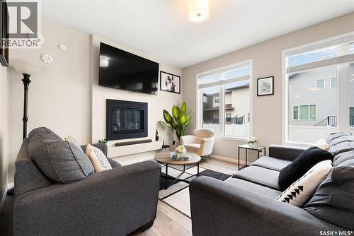 3104 Trombley Street, Regina, SK - Indoor Photo Showing Living Room With Fireplace