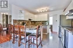 Marble counters and backsplash. Porcelain tile flr - 