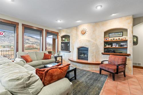 289 Inverness Drive, Coldstream, BC - Indoor Photo Showing Living Room With Fireplace