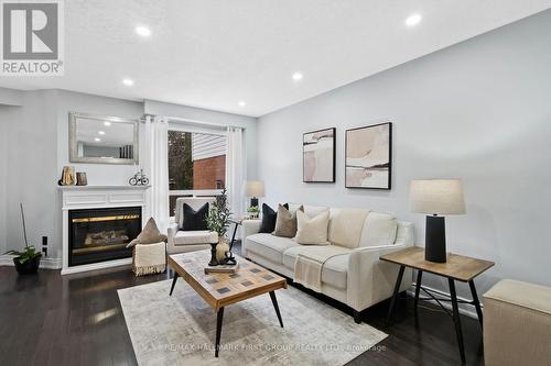 1696 Woodgate Trail, Oshawa, ON - Indoor Photo Showing Living Room With Fireplace