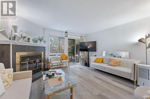 B - 6702 Jeanne D'Arc Boulevard N, Ottawa, ON - Indoor Photo Showing Living Room With Fireplace