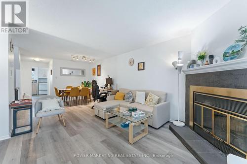 B - 6702 Jeanne D'Arc Boulevard N, Ottawa, ON - Indoor Photo Showing Living Room With Fireplace