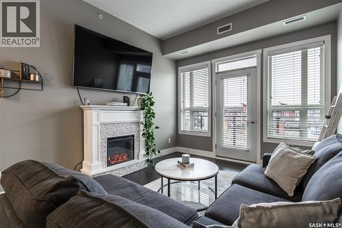 307 415 Maningas Bend, Saskatoon, SK - Indoor Photo Showing Living Room With Fireplace