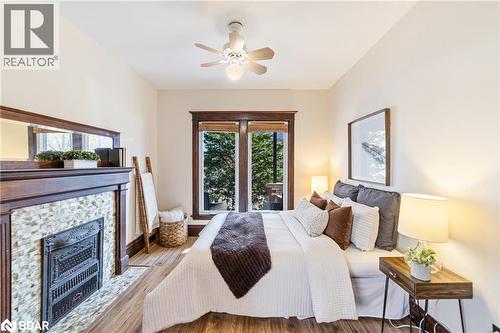 58 Lorne Avenue, Hamilton, ON - Indoor Photo Showing Bedroom With Fireplace