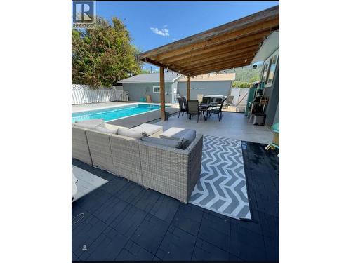 Poolside patio - 225 Circle Drive, Oliver, BC - Outdoor With In Ground Pool With Deck Patio Veranda With Exterior