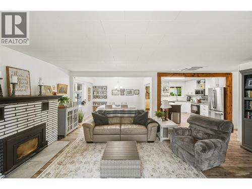 Living room - 225 Circle Drive, Oliver, BC - Indoor Photo Showing Living Room With Fireplace
