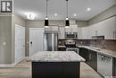109 415 Maningas Bend, Saskatoon, SK  - Indoor Photo Showing Kitchen With Stainless Steel Kitchen With Upgraded Kitchen 
