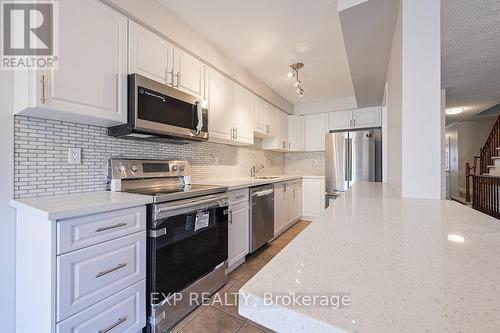 144 - 5255 Palmetto Place, Mississauga, ON - Indoor Photo Showing Kitchen With Stainless Steel Kitchen With Upgraded Kitchen