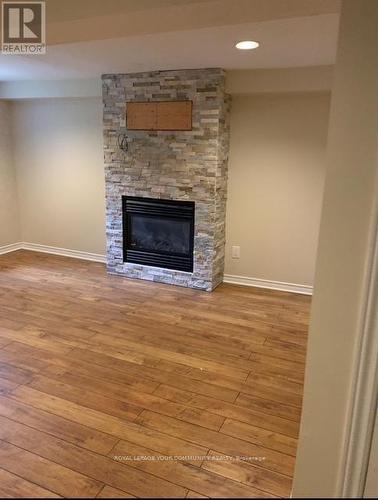 Basement - 96 Gurnett Street, Aurora, ON - Indoor Photo Showing Living Room With Fireplace