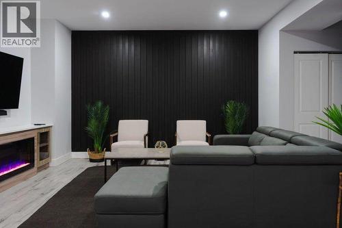 VIRTUALLY STAGED - 722 Coopland Crescent Unit# 1, Kelowna, BC - Indoor With Fireplace