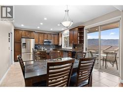 Dining to kitchen with access to spacious covered deck - 