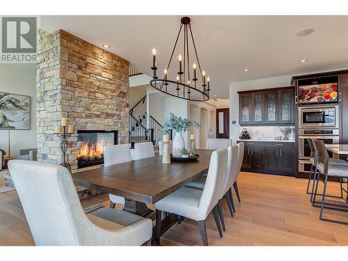 716 Kuipers Crescent, Kelowna, BC - Indoor Photo Showing Dining Room With Fireplace