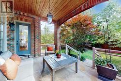 Kitchen to Covered Porch Over Looking the Backyard - 